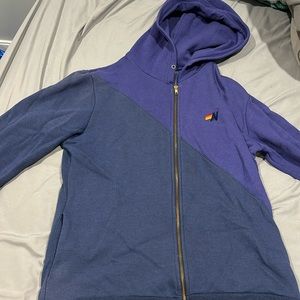 Woman purple half and half zip up sweatshirt